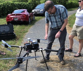 Faculty and students prepare for a drone test flight