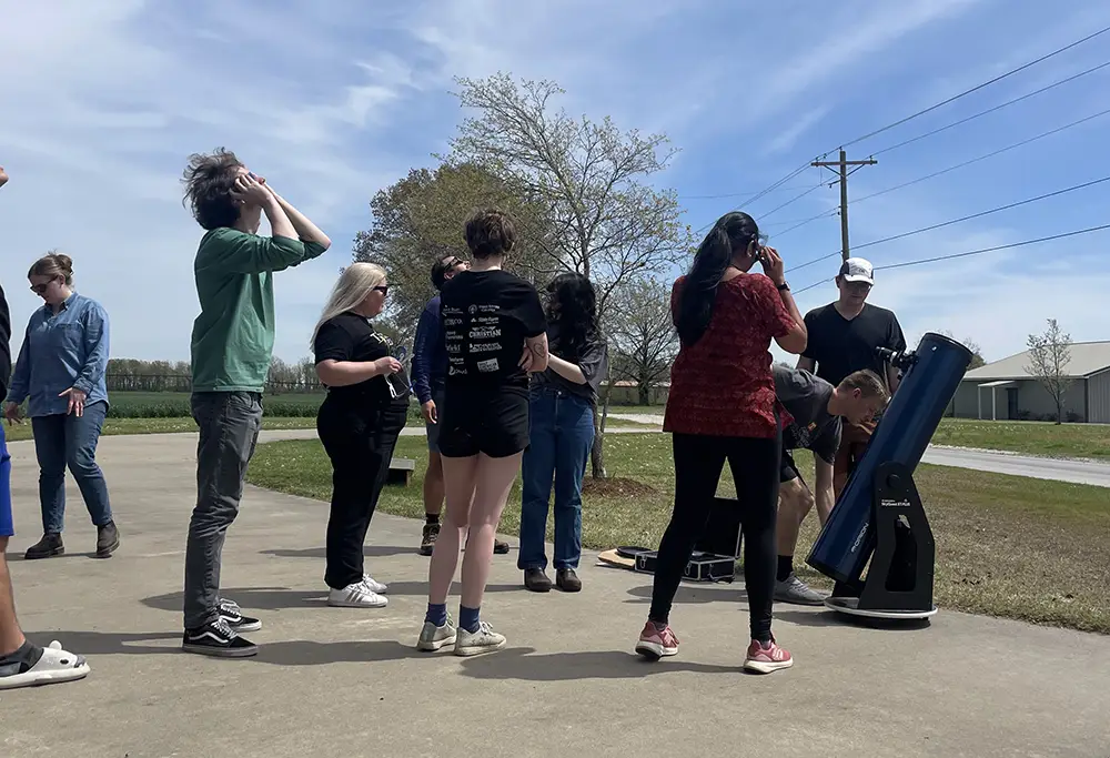 A group of people looking up at the sky