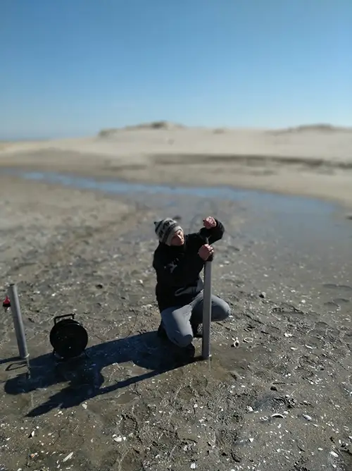 Anner Paldor setting up research equipment in the field